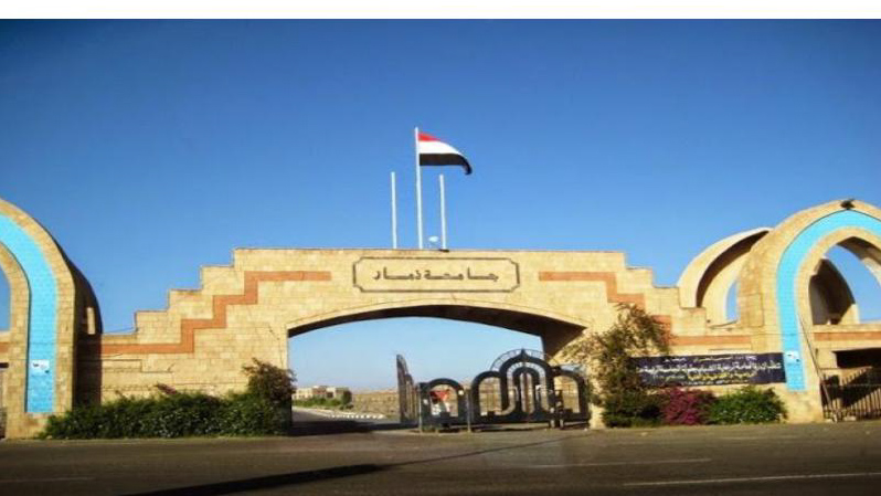 Entrance of a place university with a flag on top of it